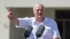 BELARUS -- Belarusian President Alyaksandr Lukashenka gestures as he delivers a speech during a rally of his supporters near the Government House on Independence Square in Minsk, August 16, 2020