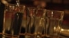 Czech Republic -- A bartender serves alcohol at a bar in Prague, 12Sep2012