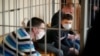 Nikita Zolotarev, Dmitry Korneev, Leonid Kovalev at Gomel court. photo by tut.by
